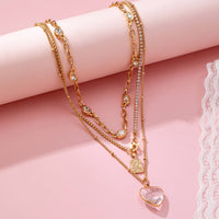 Multi Layered Rhinestone Heart Charm Necklace | 80N92691-JOSSLYN by wall to wall-R3vel Threads, Women's Fashion Boutique, Located in Hudsonville, Michigan