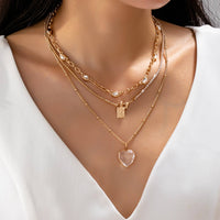 Multi Layered Rhinestone Heart Charm Necklace | 80N92691-JOSSLYN by wall to wall-R3vel Threads, Women's Fashion Boutique, Located in Hudsonville, Michigan