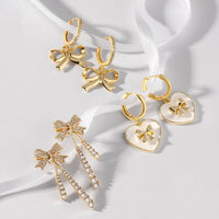 Bow Heart Huggie-Splendid Iris-R3vel Threads, Women's Fashion Boutique, Located in Hudsonville, Michigan