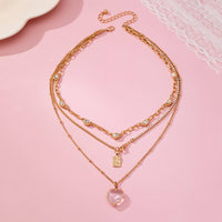 Multi Layered Rhinestone Heart Charm Necklace | 80N92691-JOSSLYN by wall to wall-R3vel Threads, Women's Fashion Boutique, Located in Hudsonville, Michigan