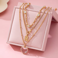 Multi Layered Rhinestone Heart Charm Necklace | 80N92691-JOSSLYN by wall to wall-R3vel Threads, Women's Fashion Boutique, Located in Hudsonville, Michigan